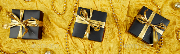 Banner with Luxury black gift boxes with gold ribbon - Stock Photo - Images