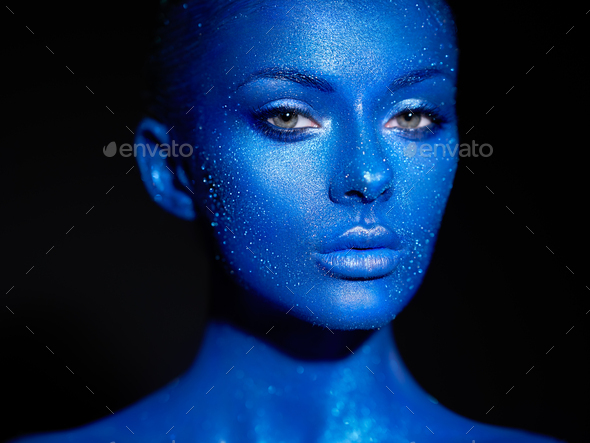 Portrait of beautiful woman with sparkles on her face - Stock Photo - Images