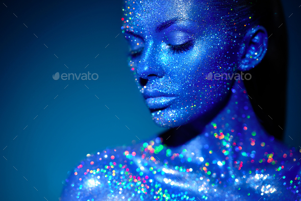 Portrait of beautiful woman with sparkles on her face - Stock Photo - Images