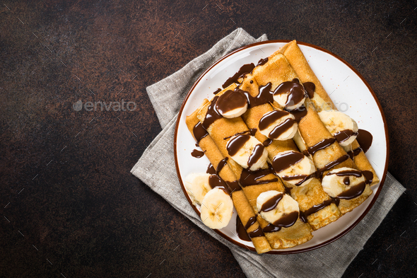 Crepes with chocolate and banana top view - Stock Photo - Images