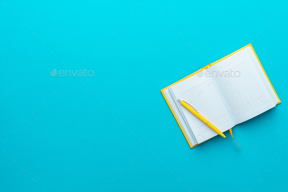 Top View Of Opened Notebook And Pen On Turquoise Blue Background With Copy Space - Stock Photo - Images