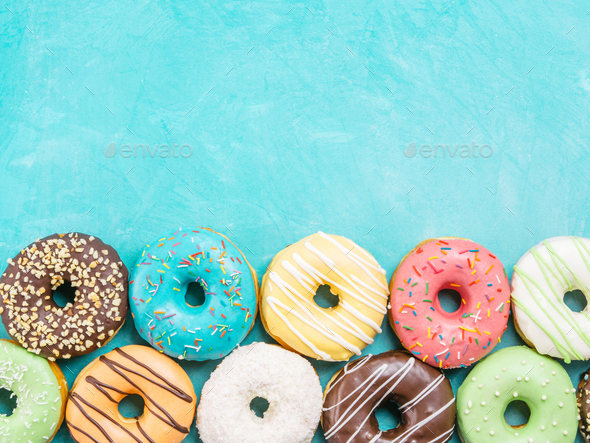 donuts on blue background , copy space, top view - Stock Photo - Images