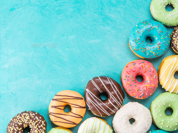 donuts on blue background , copy space, top view - Stock Photo - Images