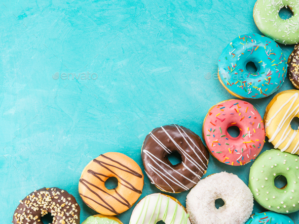 donuts on blue background , copy space, top view - Stock Photo - Images