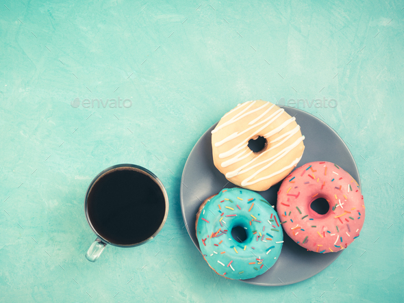 donuts on blue background , copy space, top view - Stock Photo - Images