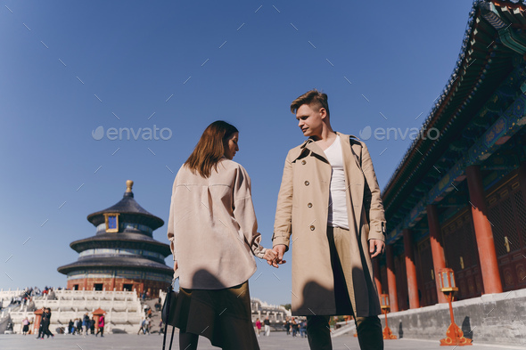 beautiful couple very much in love exploring China on their honeymoon - Stock Photo - Images
