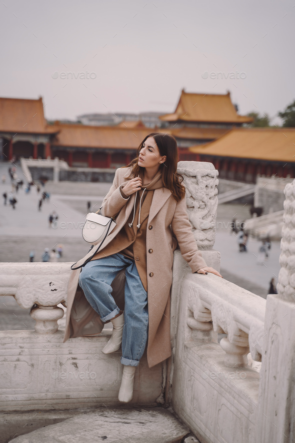 stylish girl visiting the forbidden city in Beijing China