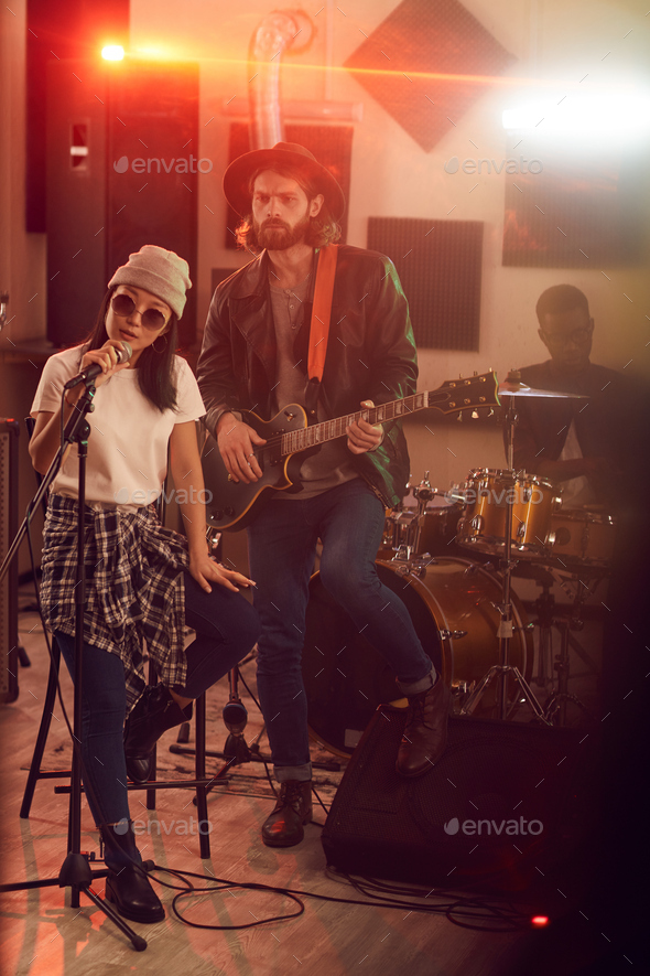 Contemporary Music Band Playing in Studio - Stock Photo - Images