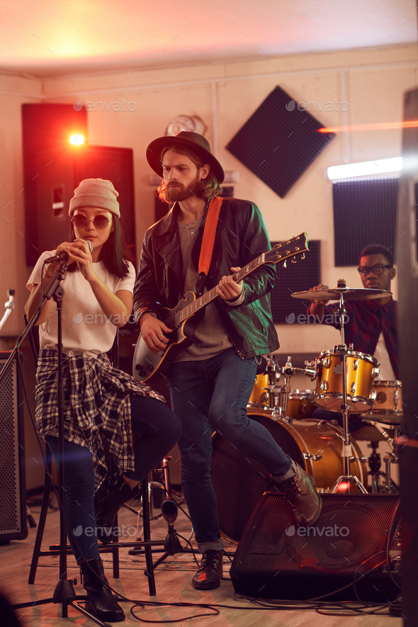 Contemporary Band Playing in Studio - Stock Photo - Images