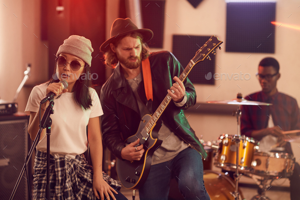 Music Band Playing in Studio - Stock Photo - Images