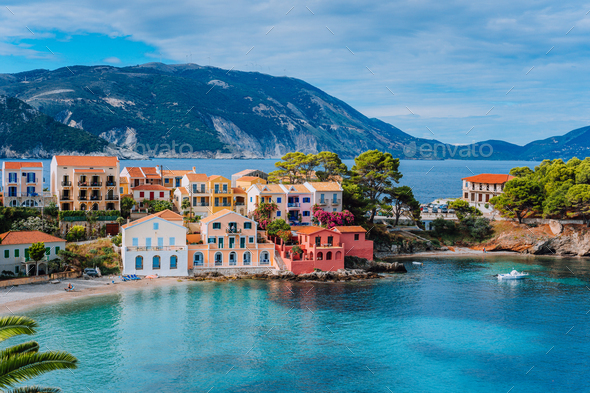 Beautiful panoramic view of Assos village with vivid colorful houses near blue turquoise colored and - Stock Photo - Images