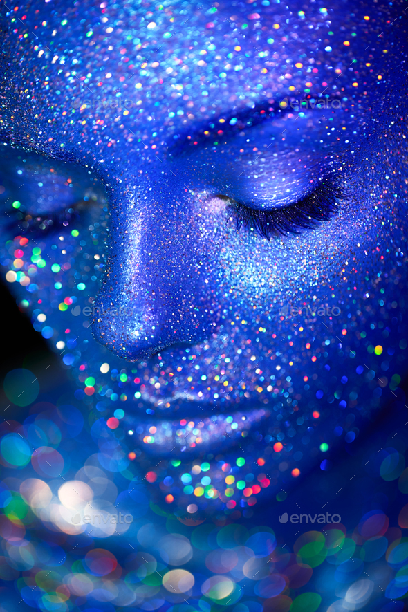 Portrait of beautiful woman with sparkles on her face - Stock Photo - Images