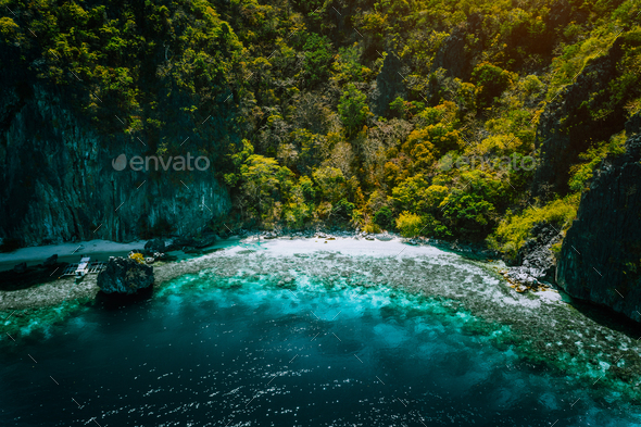 El Nido, Palawan, Philippines, aerial view of banca boat, karst mountain wall pristine sand beach - Stock Photo - Images