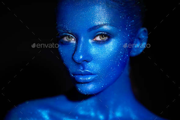 Portrait of beautiful woman with sparkles on her face - Stock Photo - Images