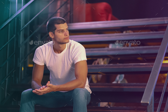 Close-up portrait of attractive male model. Young handsome man in a bar - Stock Photo - Images