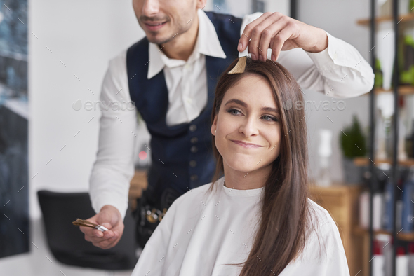 Young Woman Choosing Of Color To Hair Dye Stock Photo By Gpointstudio