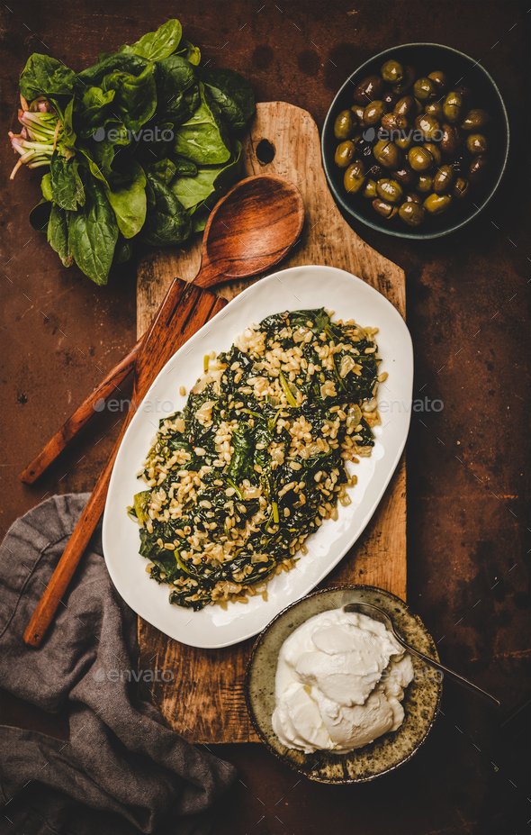 Flat-lay of Turkish traditional dish Bulgur and spinach - Stock Photo - Images