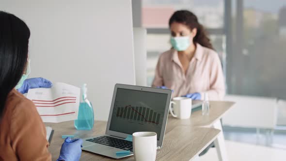 Zoom out video of women keeping the rules social distance. Shot with RED helium camera in 8K. alt