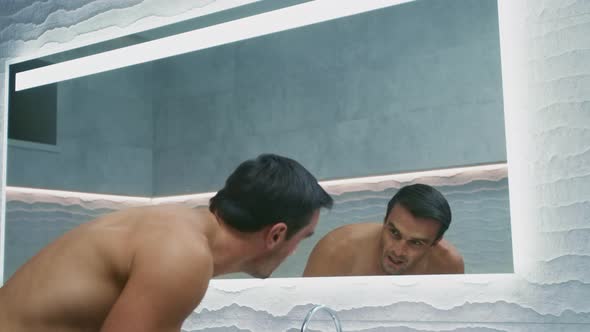 Happy Man Congratulating Himself in Bathroom. Proud Man Washing Face. alt