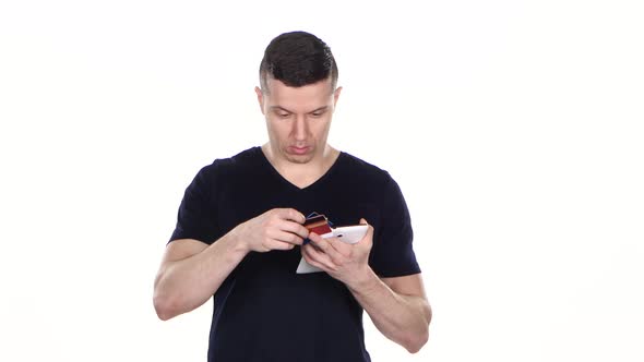 Online Shopping. Many Credit Cards and a Tablet in the Hands of Men. White. alt