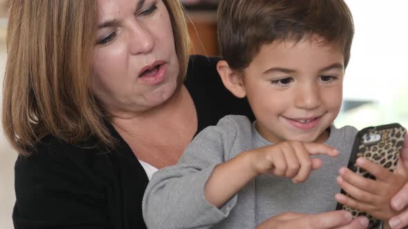 Mother and Son using smartphone together