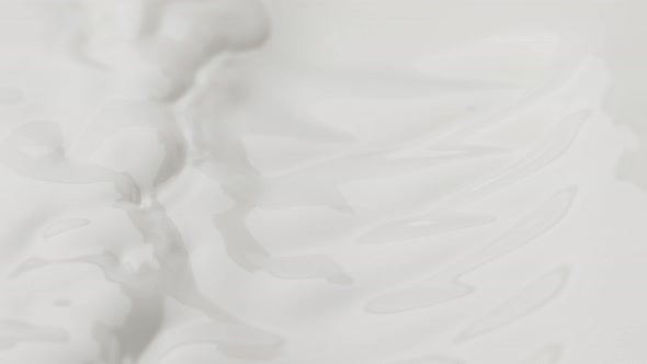 Super Slow Motion Shot of Waving Fresh Milk at 1000 Fps alt