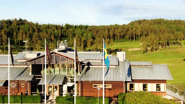 Aerial orbiting around Hills Golf Club building in Molndal near Gothenburg, Sweden alt