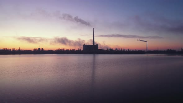 Power Plant Smokestack at Sunrise. Environmental Pollution