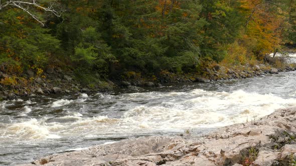 Mixed forests of Canada are filled with bodies of water like this stunning river alt