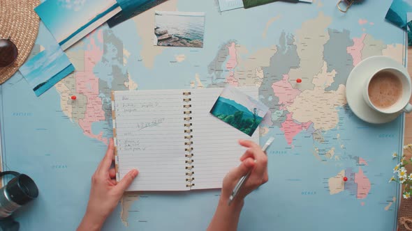 Woman Writing in Notebook About Trip alt