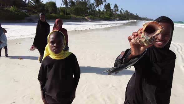 A Group of African Children Extort Money on a Beach in Zanzibar Africa alt