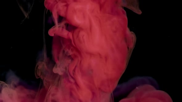 Red Paint Drop Spreads in Water alt