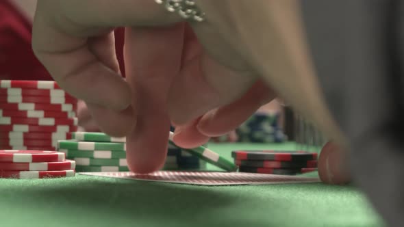 A Closeup of Checking Poker Pair of Cards