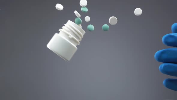 Hand in Glove Throws Pill Bottle and Tablets are Falling on Transparent Glass Surface in Slowmo alt
