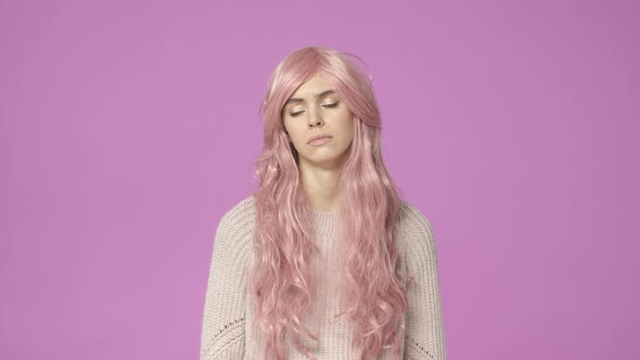 Slowmotion Sad and Grieving Young Cute Kawaii Young Girl in Pink Wig Wipe Teardrop From Eye Feeling alt