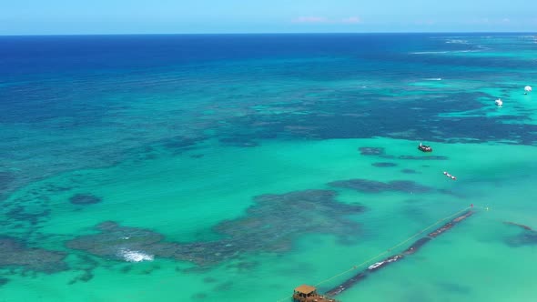 Aerial View on Tropical Coastline with Resorts and Caribbean Sea alt