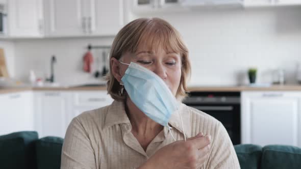 Woman Take Off Virus Mask From Her Face And Breathes Fresh Air alt
