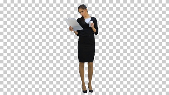 Young businesswoman reading documents, Alpha Channel