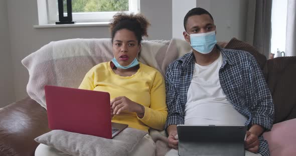 African American Man and Woman Working From Home on Coronavirus Pandemic alt