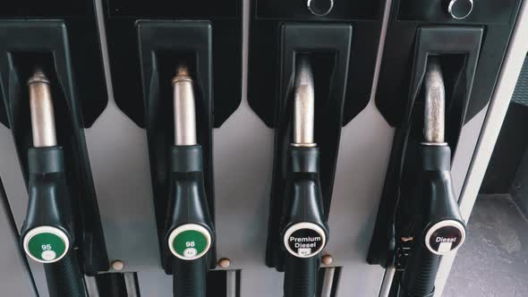 Different Gasoline Gun at a Petrol Station. Gas Fuel Pump Nozzle alt