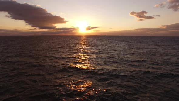 Flying Over Sea at Sunset