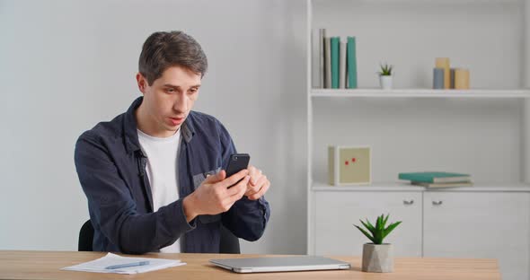 Serious Emotional Man Speaking Into Cell Mobile Phone Webcam Screen Making Online Video Conference alt