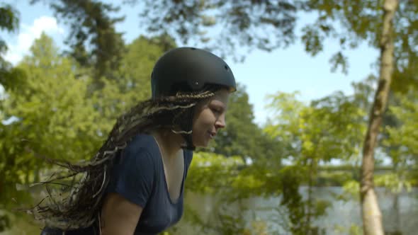 Tired Female Roller Riding Hard Breathing in Park alt