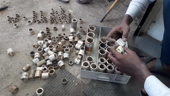 Man takes a hand metal Cylindrical Submersible Motor Bush for Submersible Openwell Pumps, Open Well alt