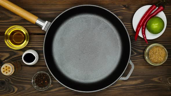 Cast iron pan for frying meat. A professional chef prepares to cooking meat in a skillet