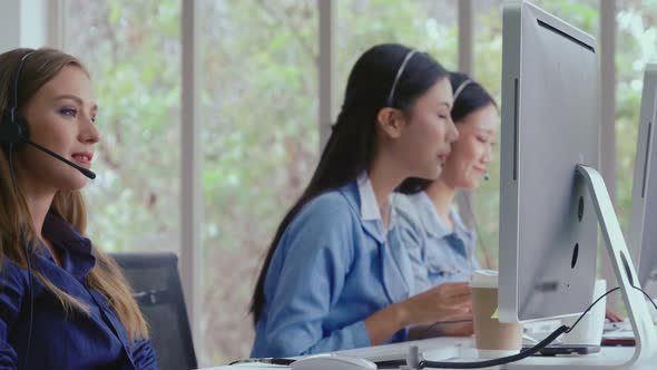 Customer Support Agent or Call Center with Headset Talking to Customer on Phone alt