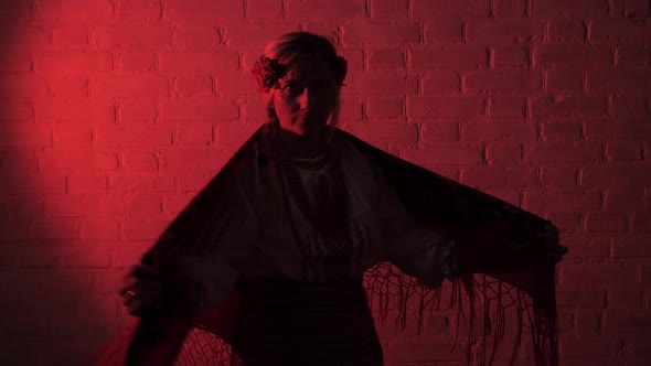 Ukrainian Women in National Dress Holding a Large Red Hand Kerchief alt