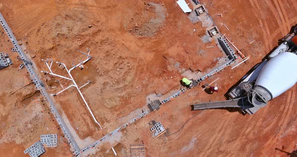 The Process of Concreting Columns on Constructing a New House Using a Concrete Mixer Truck alt