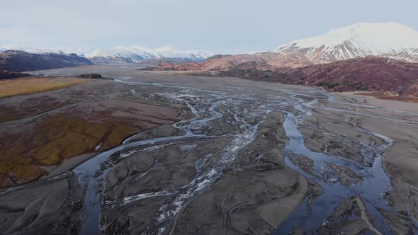 Drone Over Hvannagil Canyon And Estuary Towards Mountains alt