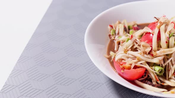 Green papaya salad put pickled crab and Pickled fish. Asian food daily style alt